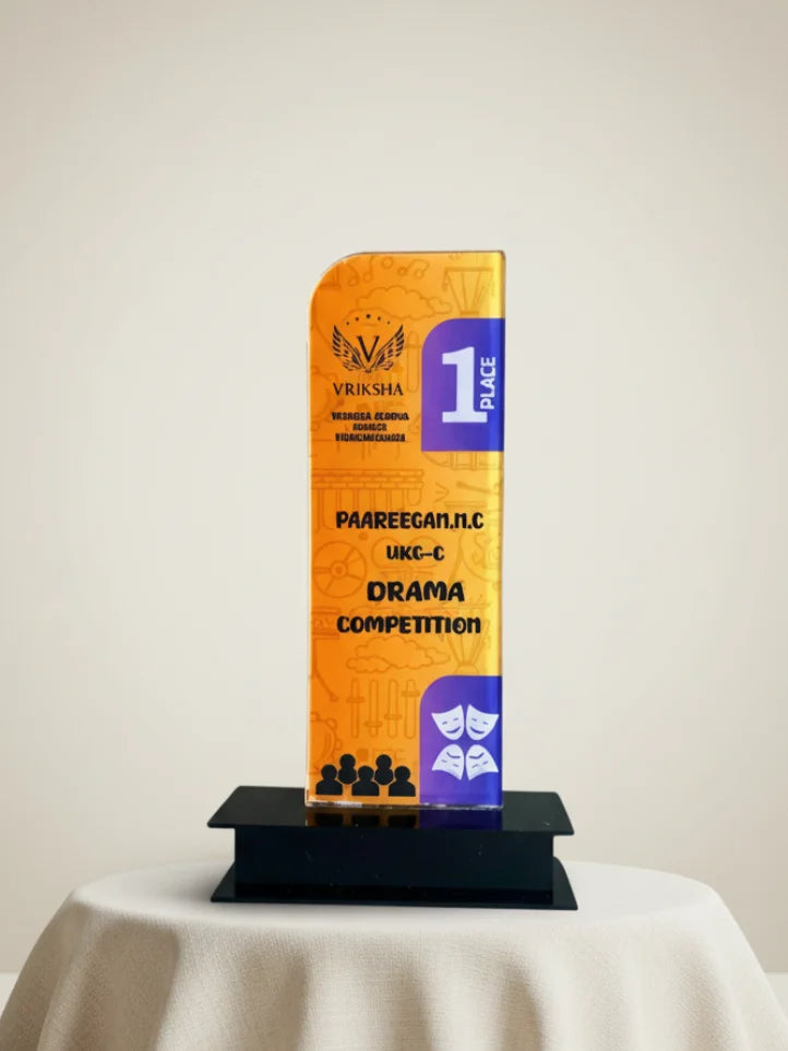 Trophy with 'Vriksha' branding and text on an orange and purple base