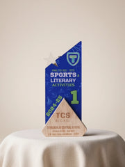 Decorative award with blue and gold design on a white surface