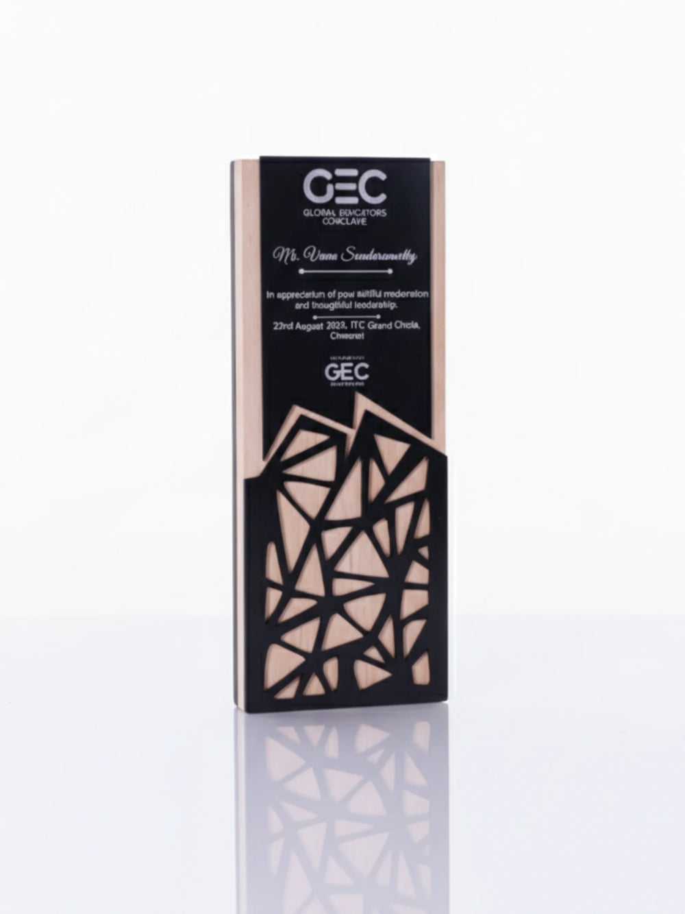Decorative box with geometric design and 'GEC' branding on a white background