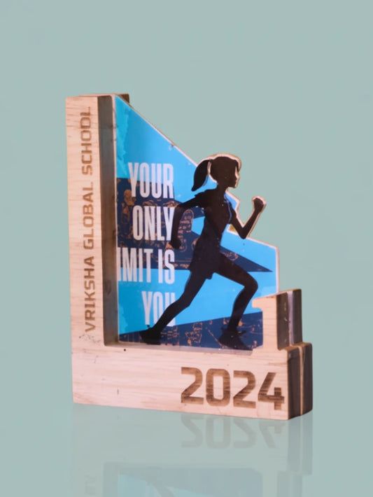 Wooden award with a running woman silhouette and '2024' on a light blue background