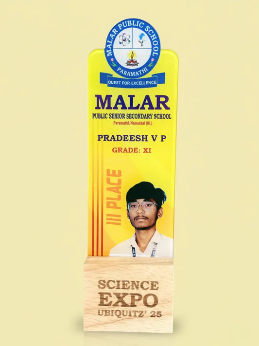 Award plaque for Malar Public School Science Expo with a student's photo and text on a yellow background