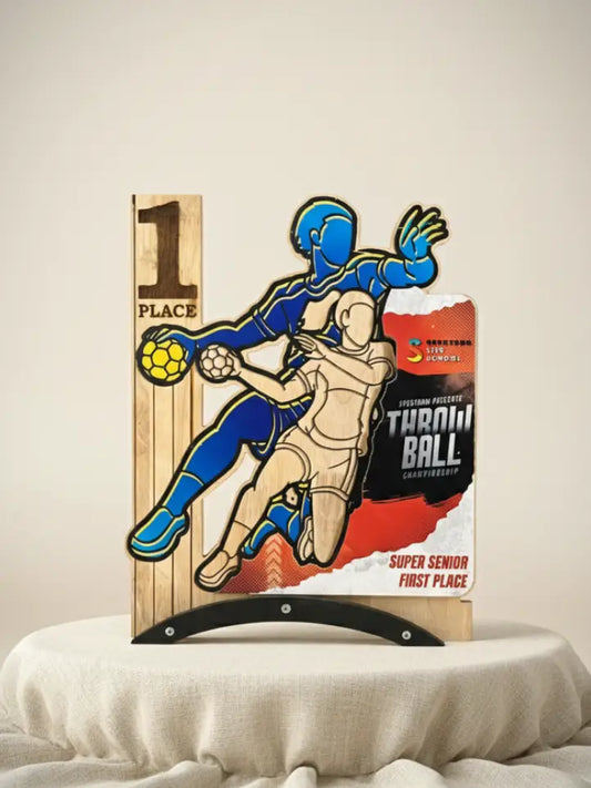 Wooden plaque with a design of two people playing a game, placed on a box labeled 'Super Senior First Place'.