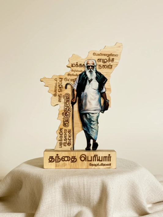 Wooden sculpture of a man holding an umbrella on a decorative stand with text
