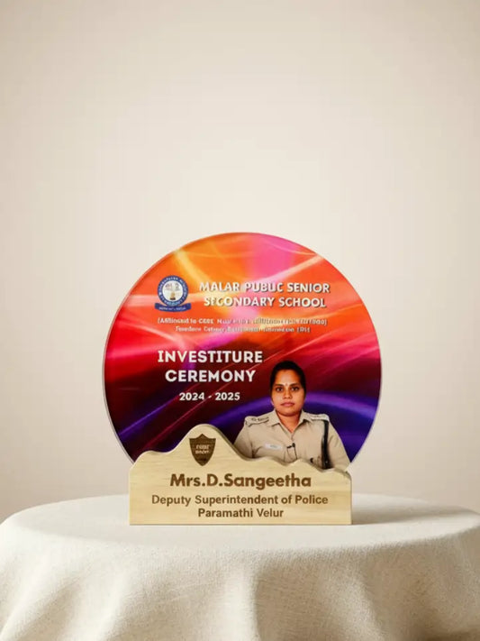 Decorative plaque for Investiture Ceremony at Malar Public Senior Secondary School with a person's image and text.