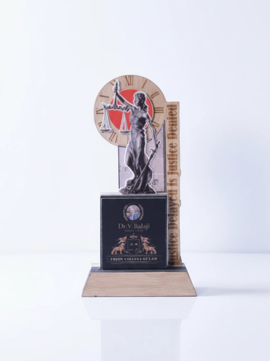Decorative award with a figure holding scales and text on a white background