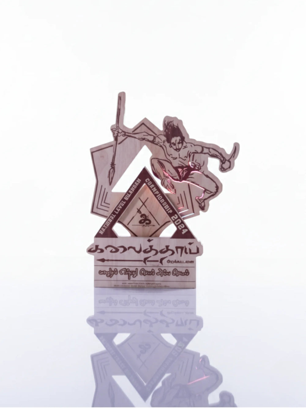Decorative item with geometric design and figure on a white background