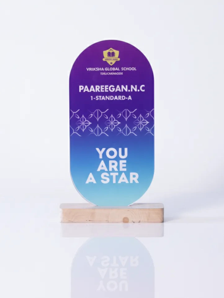 Decorative plaque with text on a stand against a white background