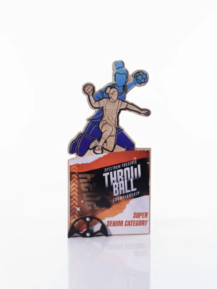 Pin with a design of two figures in action, on a card labeled 'Throw Ball Competition Super Senior Category'.