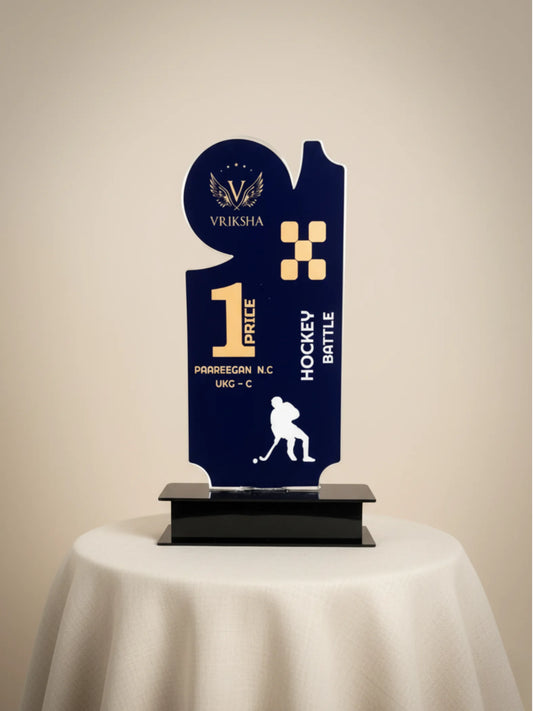 Navy blue trophy with gold accents on a beige background