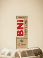 BN1 Fortune product packaging on a beige surface with a beige background
