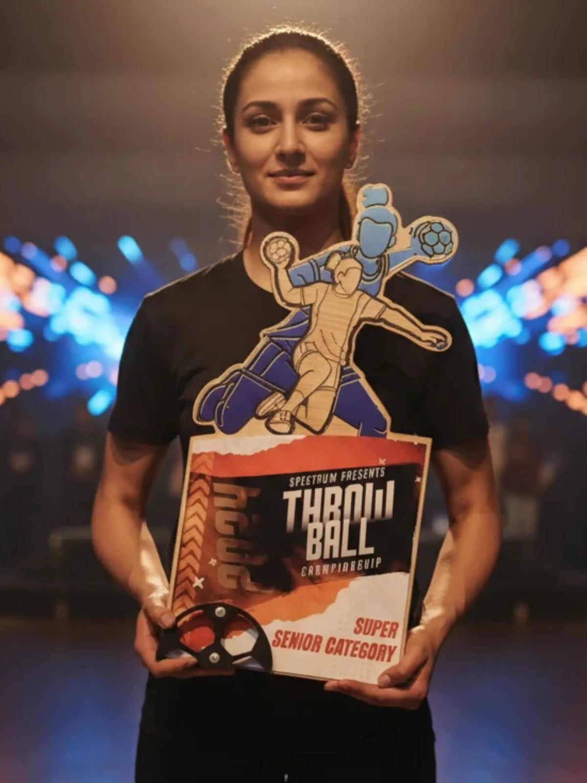 Throwball champion trophy displayed in award ceremony setting