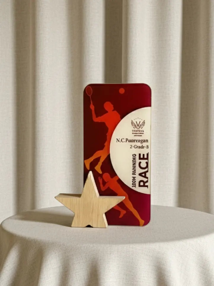 Red award plaque with a silhouette design on a beige background