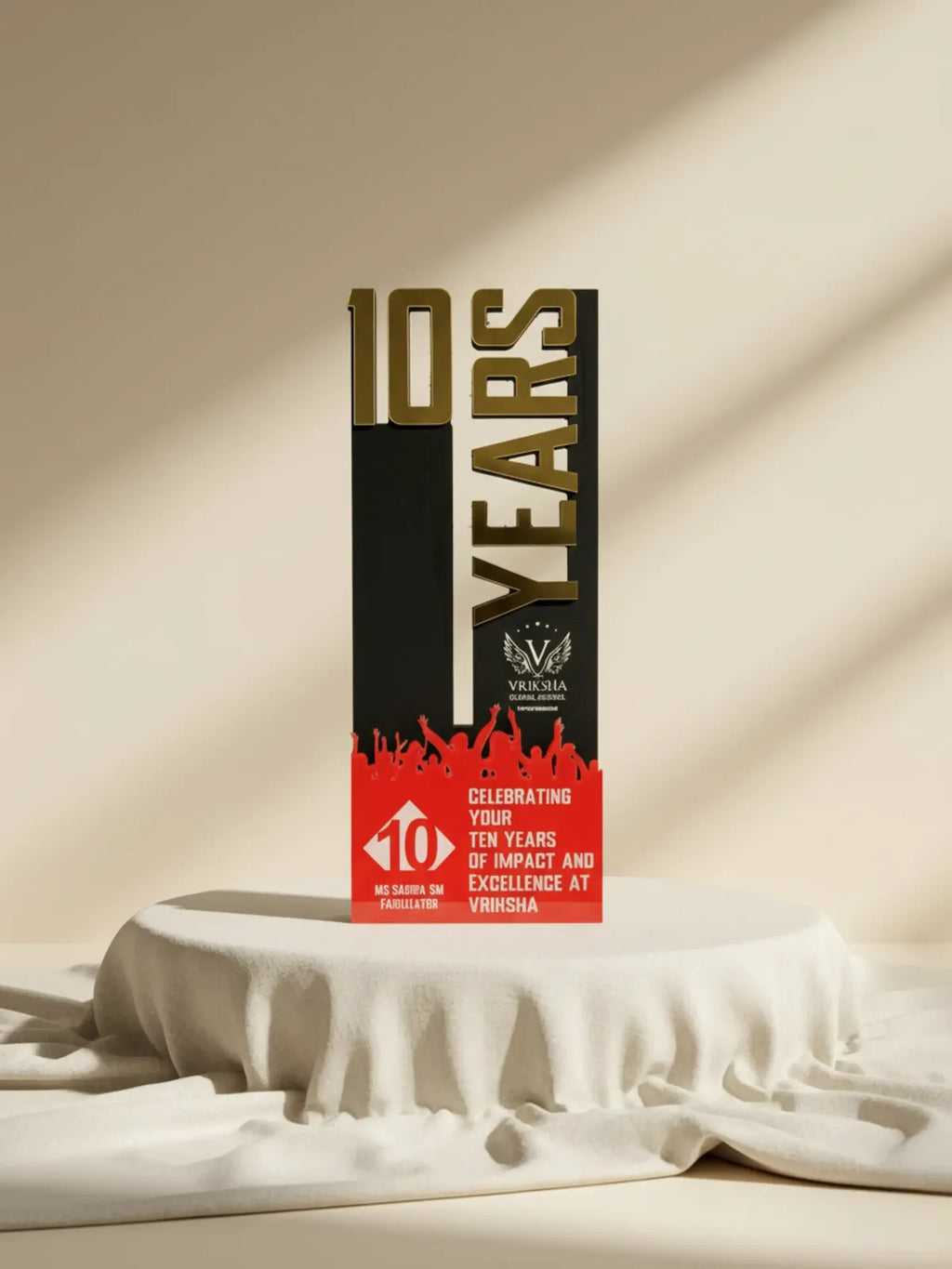 Trophy celebrating 10 years of impact and excellence on a beige background