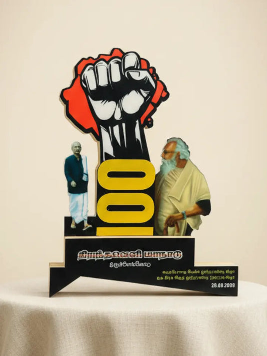 Memorial plaque with a raised fist and two figures on a beige background