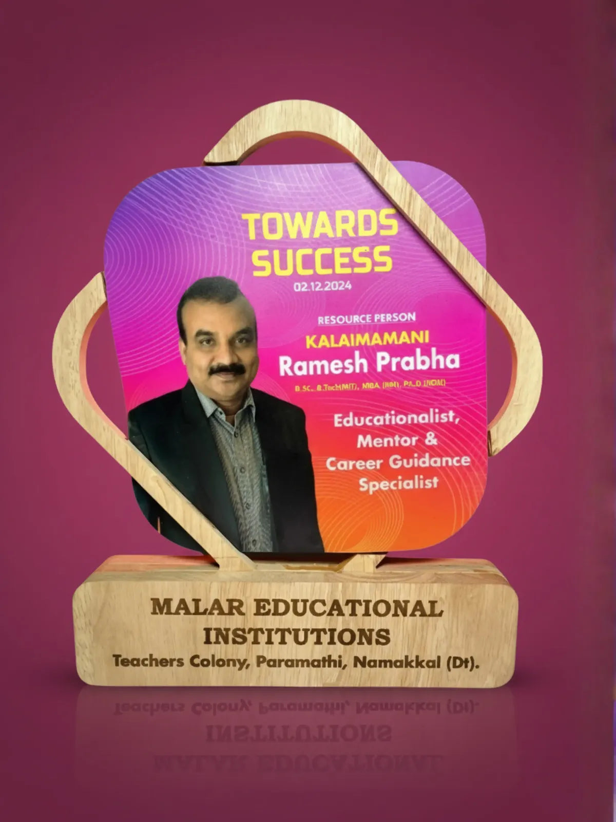 Award with a person's portrait and text on a purple background