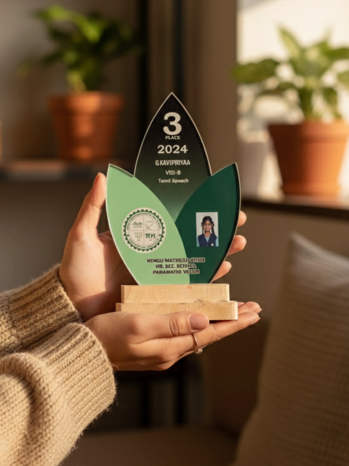 Close-up of the trophy's laser-engraved acrylic plate, featuring space for winner’s name and event details, with smooth wood finish for premium look.

