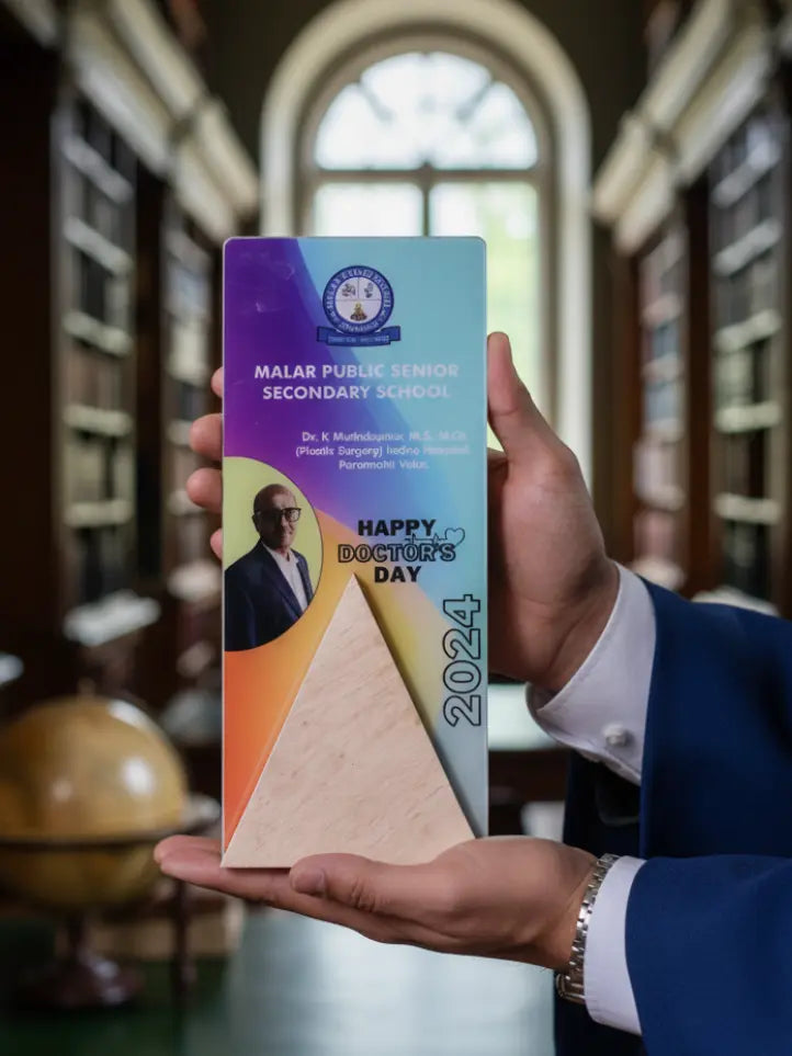 Person holding a 'Happy Doctor's Day 2024' card with a wooden model in a library setting