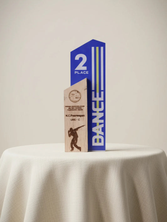 Trophy for 2nd place in a dance competition on a white tablecloth.