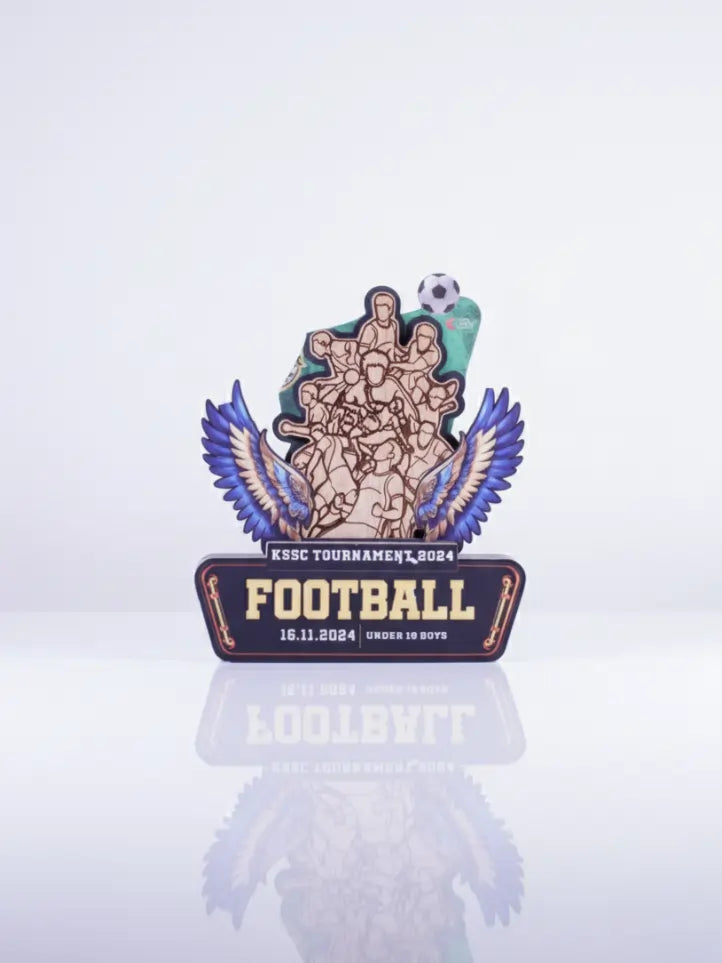 Decorative football trophy with wings on a white background