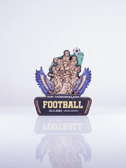 Decorative football trophy with wings on a white background