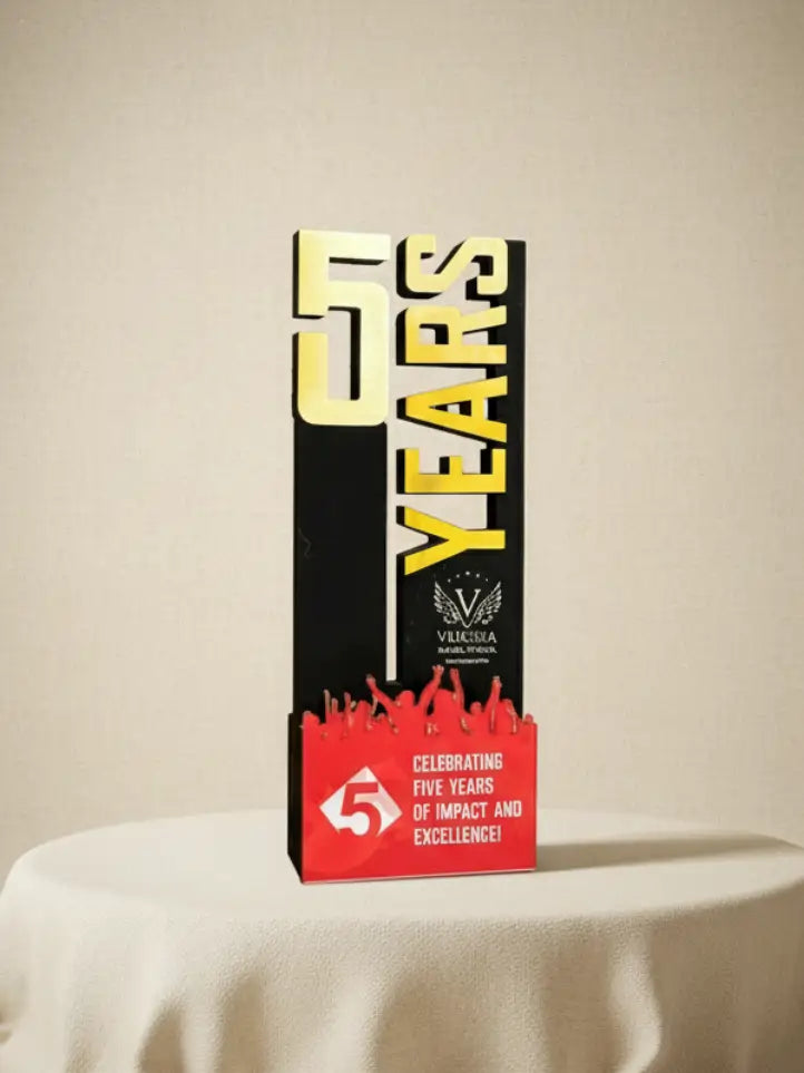 Box celebrating five years of impact and excellence on a beige background