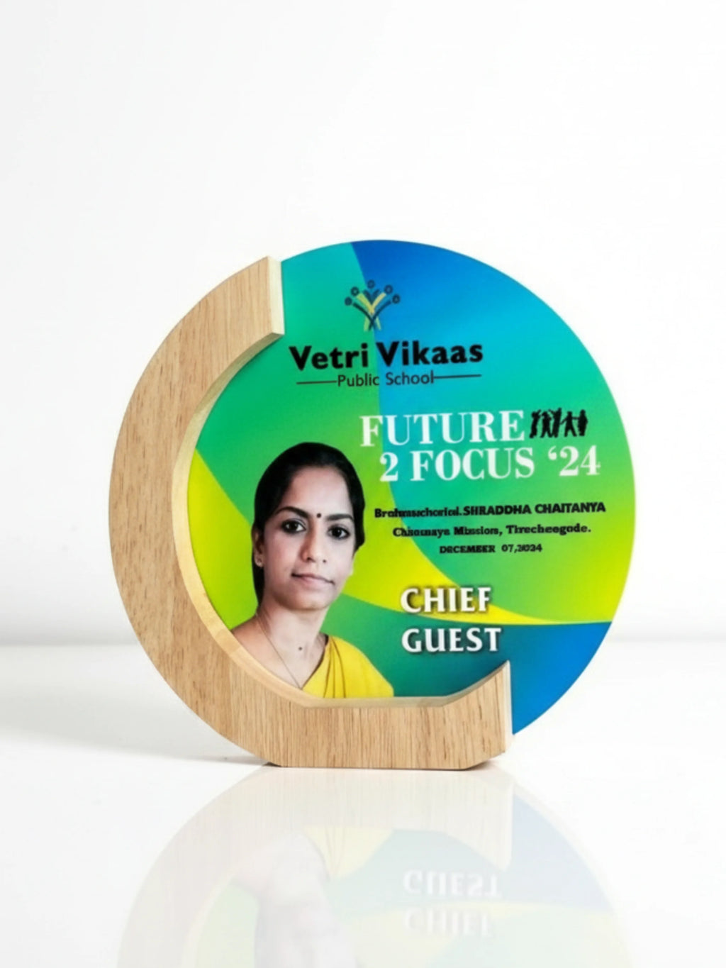 The trophy displayed on an event table with celebratory decorations, suggesting its use in formal recognition ceremonies.