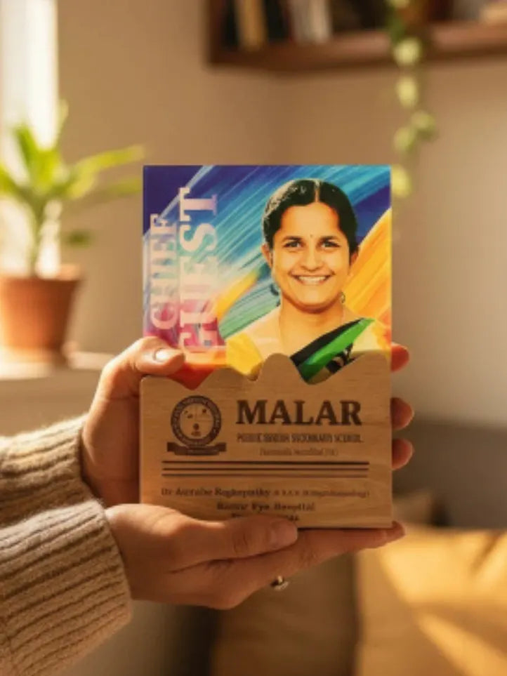 Person holding a box of Malar with a colorful label featuring a smiling woman.