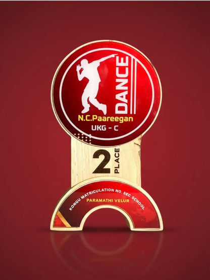 Dance competition trophy with red and gold design on a red background