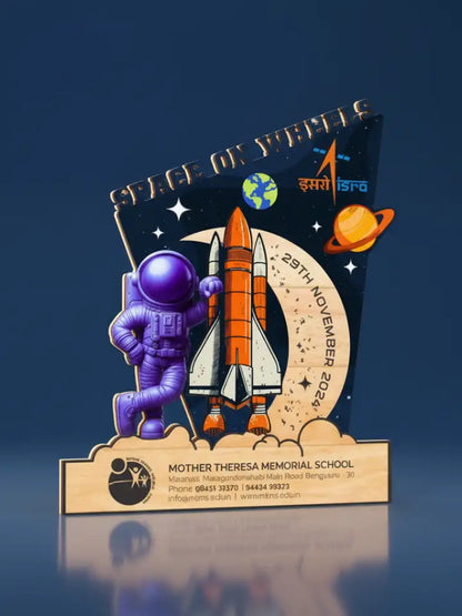 Decorative plaque with astronaut, rocket, and celestial design on a dark blue background