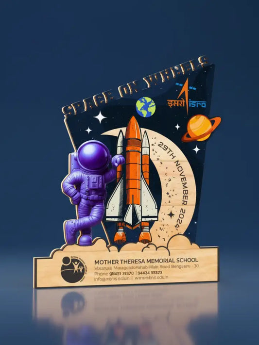Decorative plaque with astronaut, rocket, and celestial design on a dark blue background