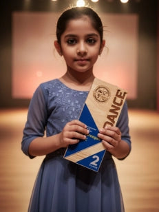 Young girl holding a dance certificate in an indoor setting