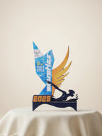 Trophy with '10 Girls' and 'Athlete of the Year' text on a beige background