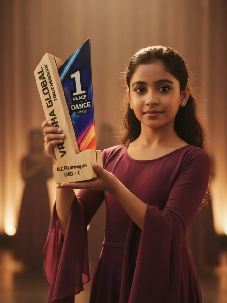 Young girl holding a dance trophy with 'Vishwa Global' branding