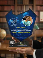 Person holding a blue and black award with a portrait and text in a library setting