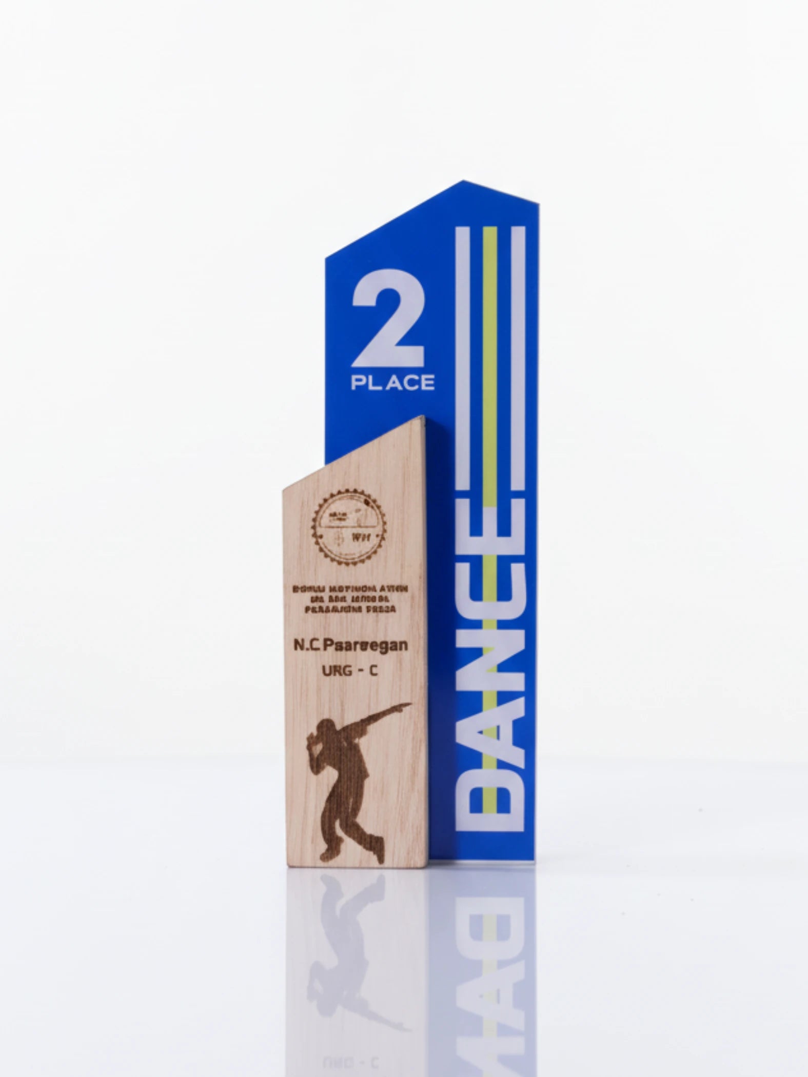 Wooden trophy with blue top and 'DANCE' branding on a white background