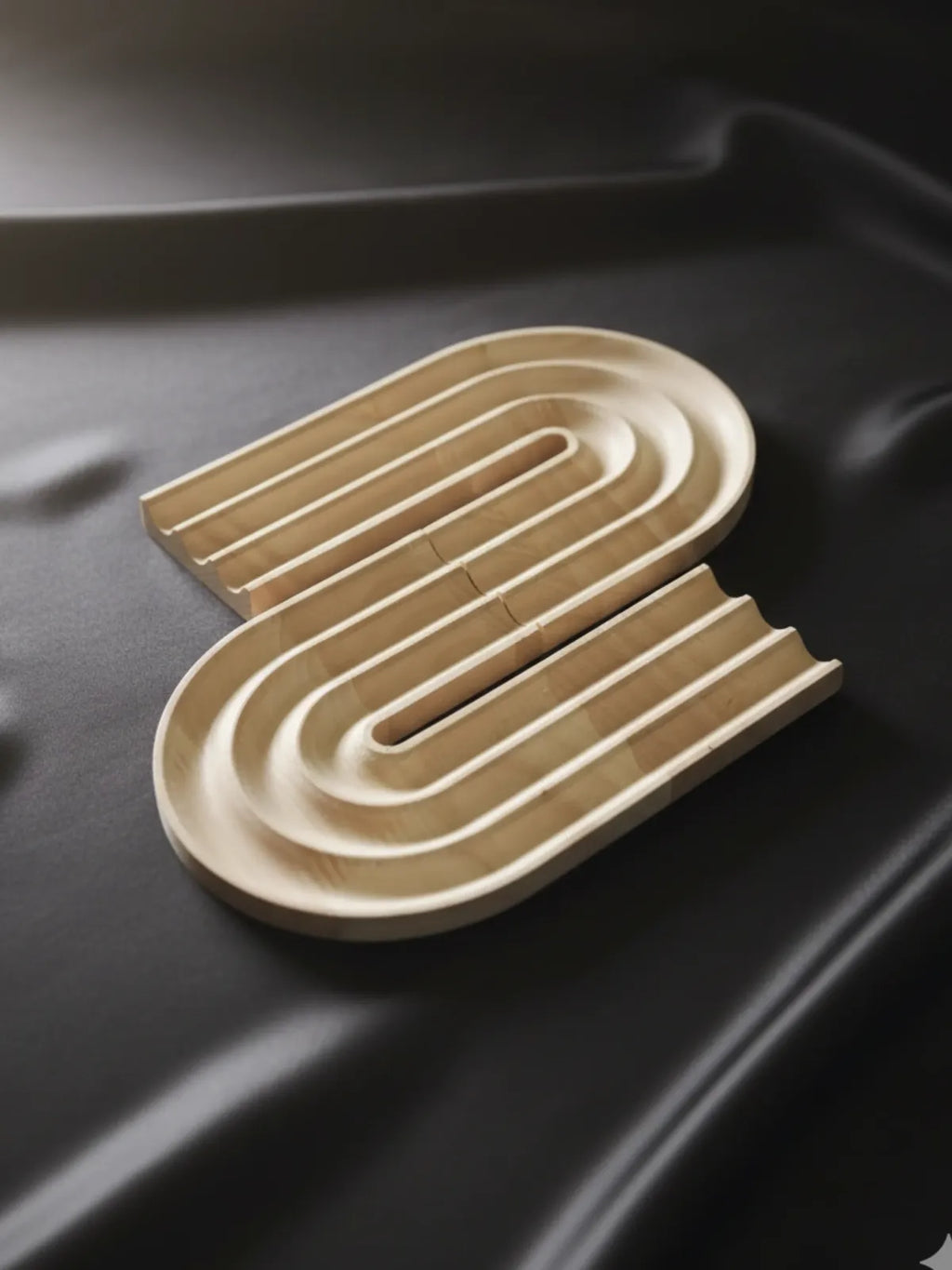 Wooden letter 'S' on a black background