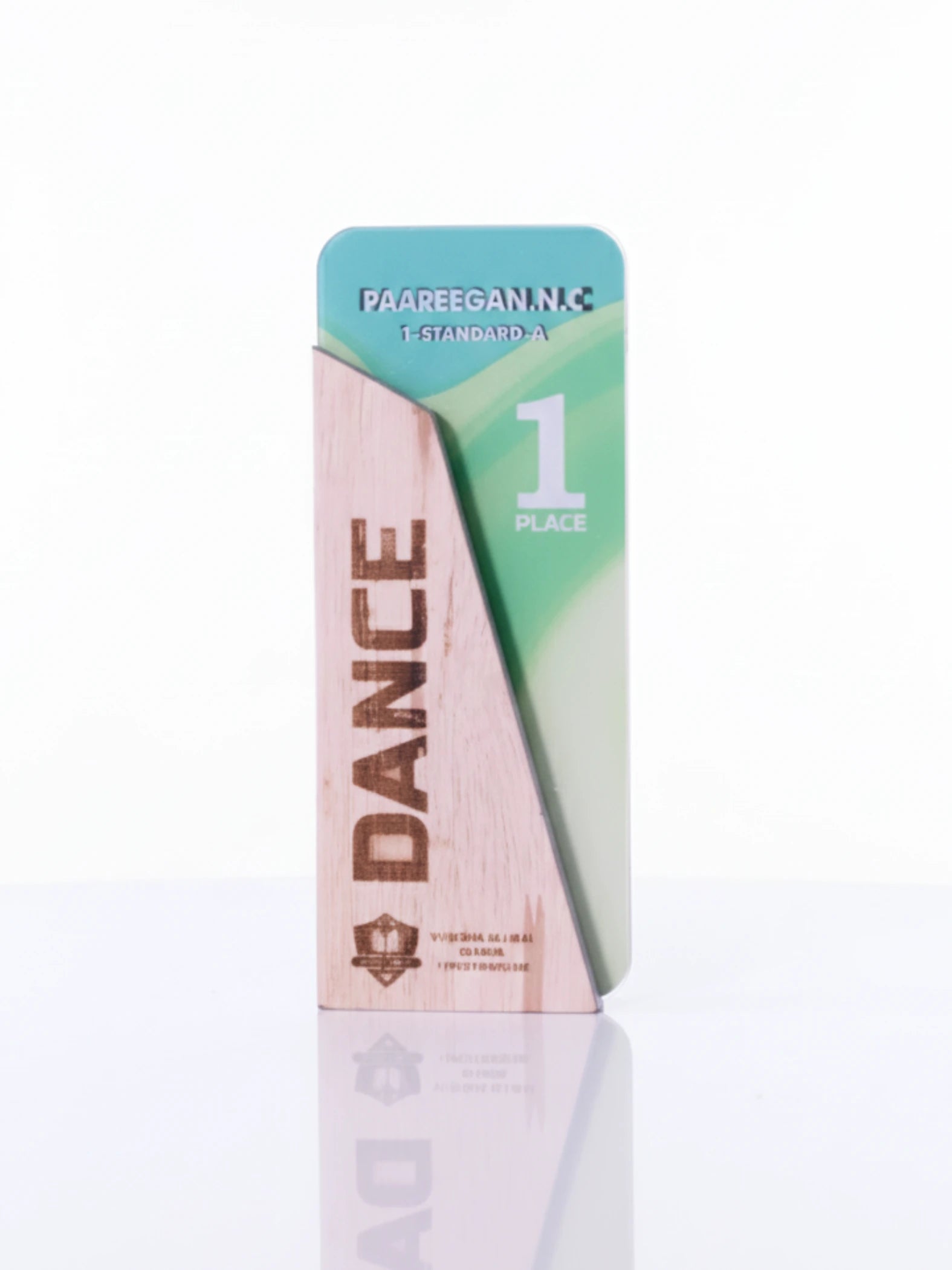 Wooden trophy with 'DANCE' engraved on a white background