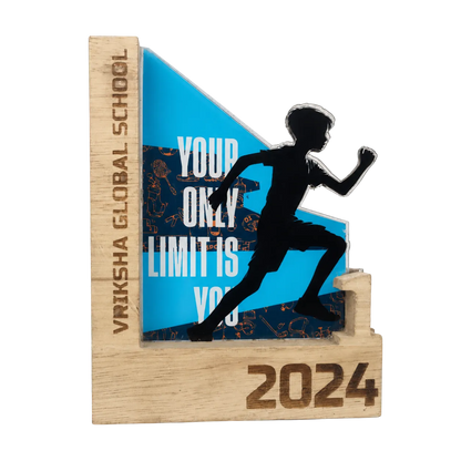 Wooden award with a running silhouette and motivational quote, featuring 'Vriksha Global School' and '2024'.