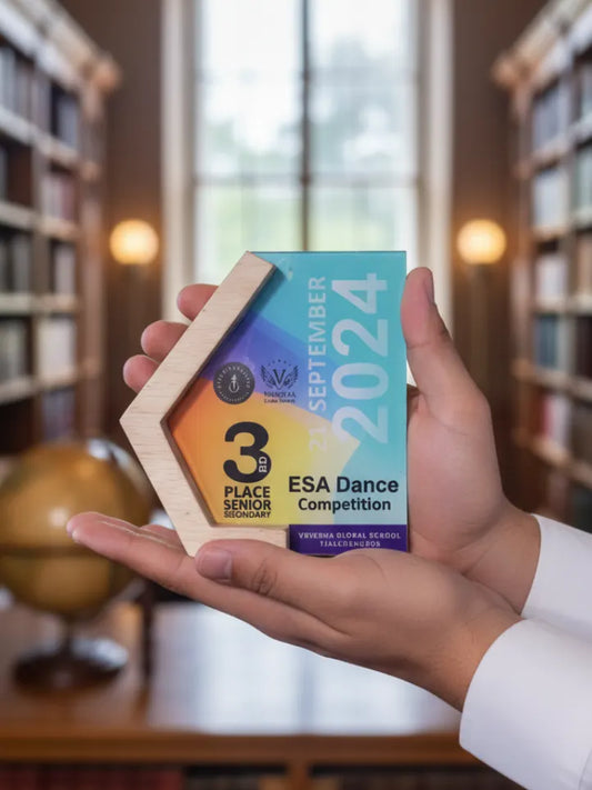 Hand holding a trophy with '3rd Place Senior' and 'ESA Dance Competition' text in a library setting.