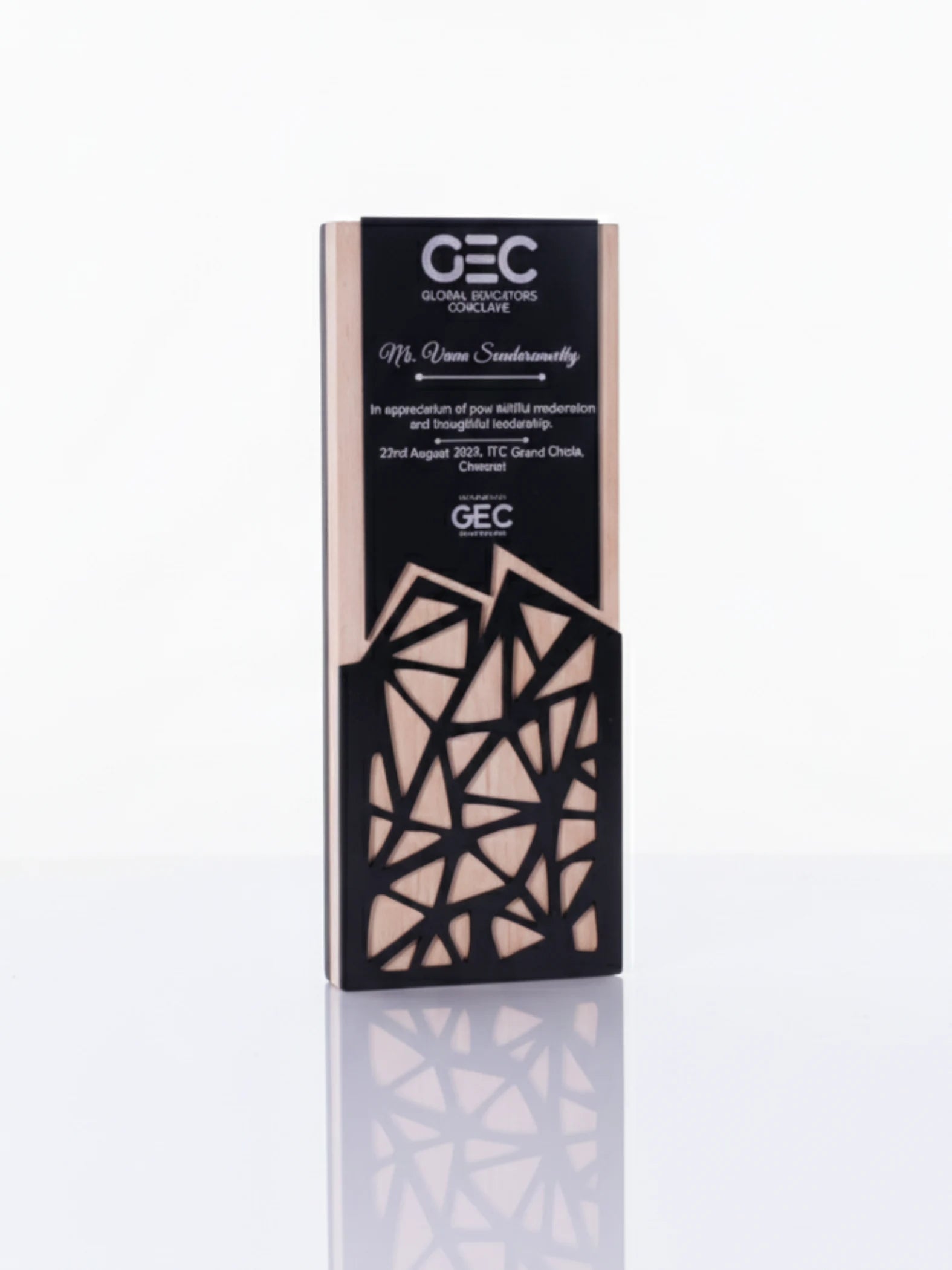 Decorative box with geometric design and 'GEC' branding on a white background