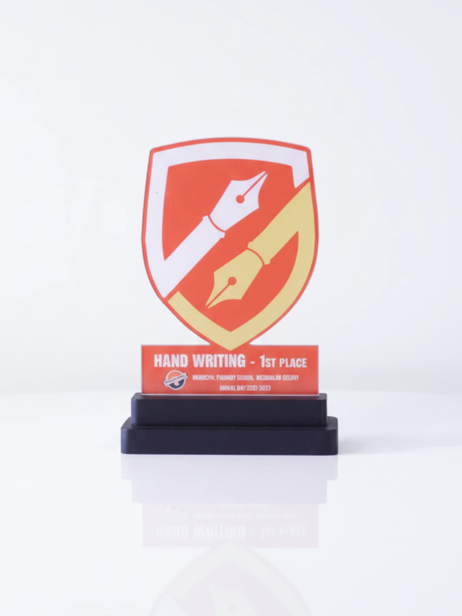 Decorative trophy with a red and yellow design on a white background