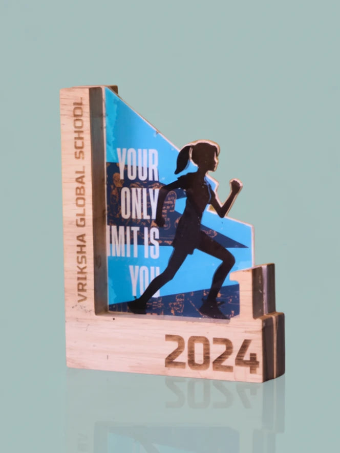 Wooden award with a running woman silhouette and '2024' on a light blue background