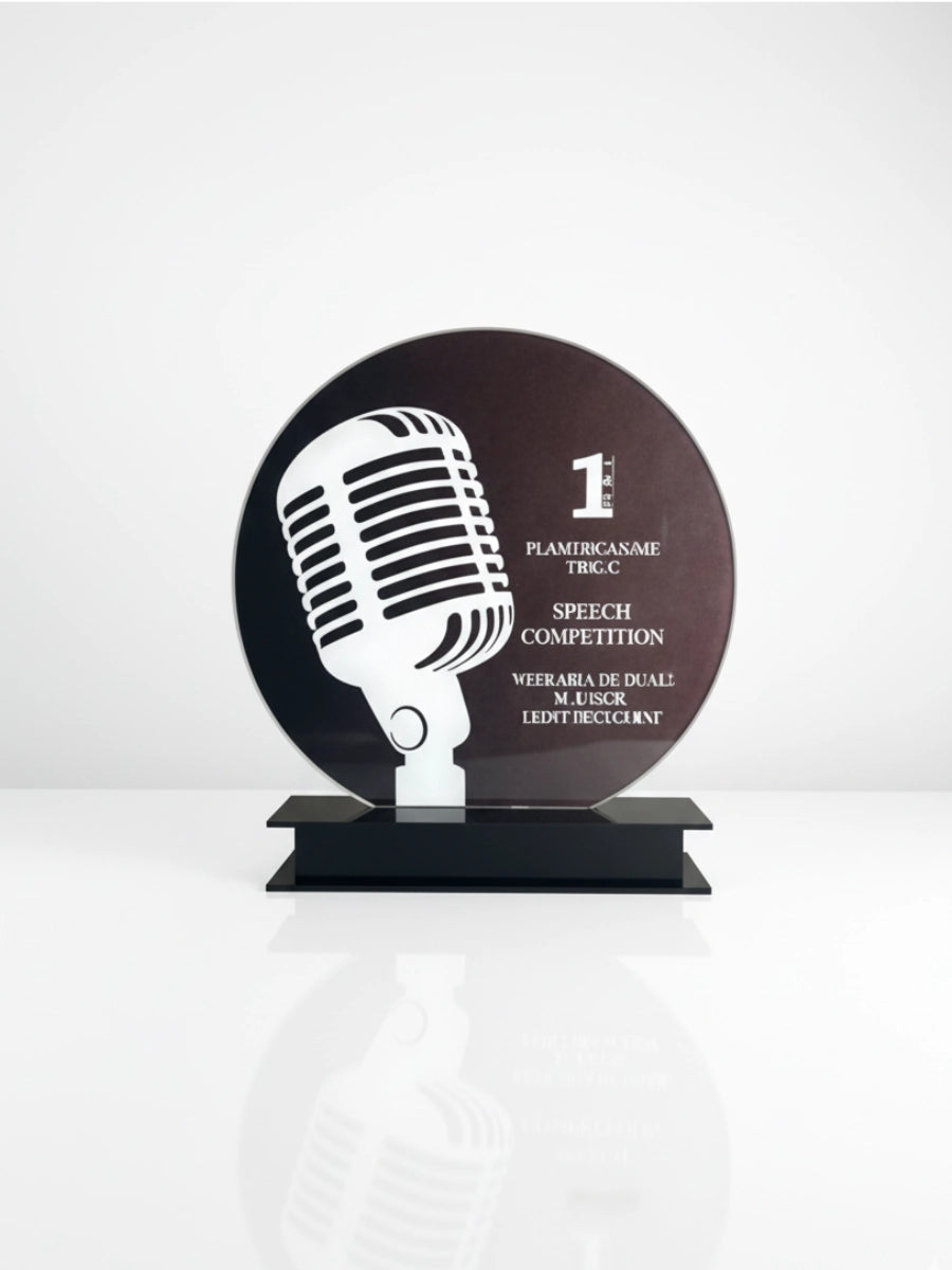 A trophy with a microphone design on a white background