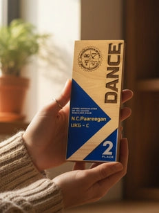 Person holding a box of N. Paaregan Dance Ultra-C 2 in a home setting