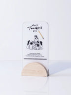 Card with 'Happy Teacher's Day' message and illustration on a white background