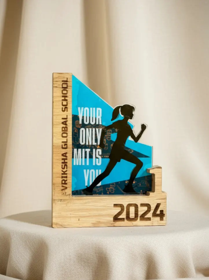 Wooden award with blue and black design featuring a running silhouette and text on a beige background