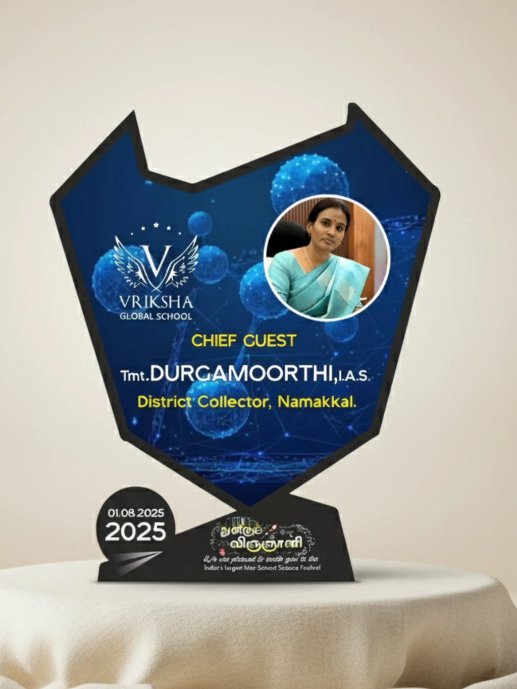 Trophy with a portrait of a woman and text on a blue background