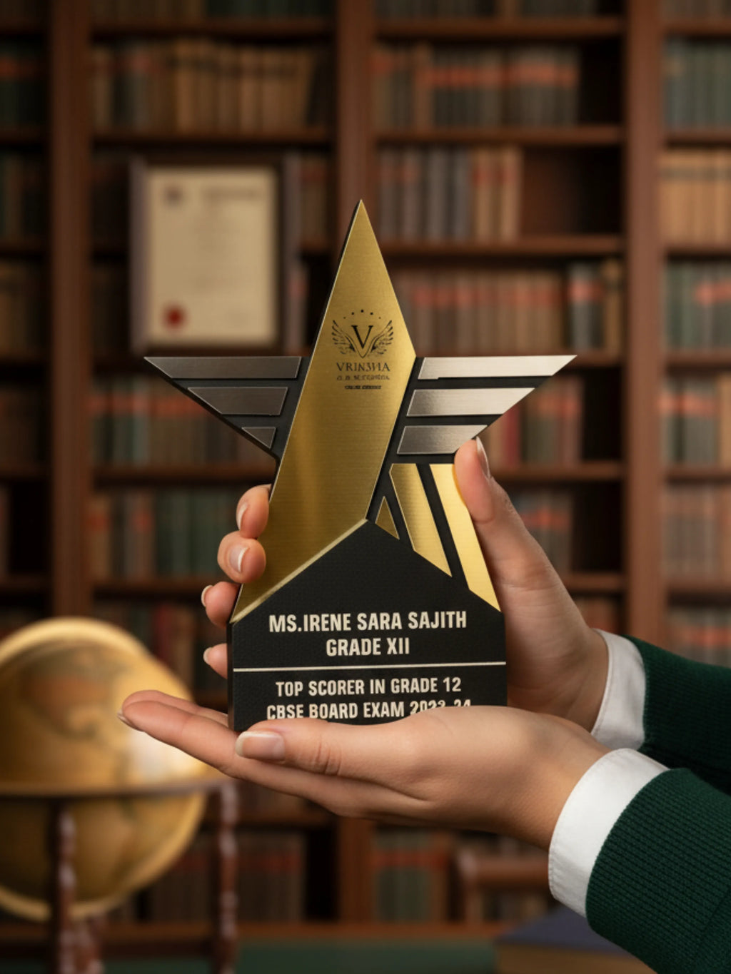 Person holding a star-shaped award in front of a bookshelf