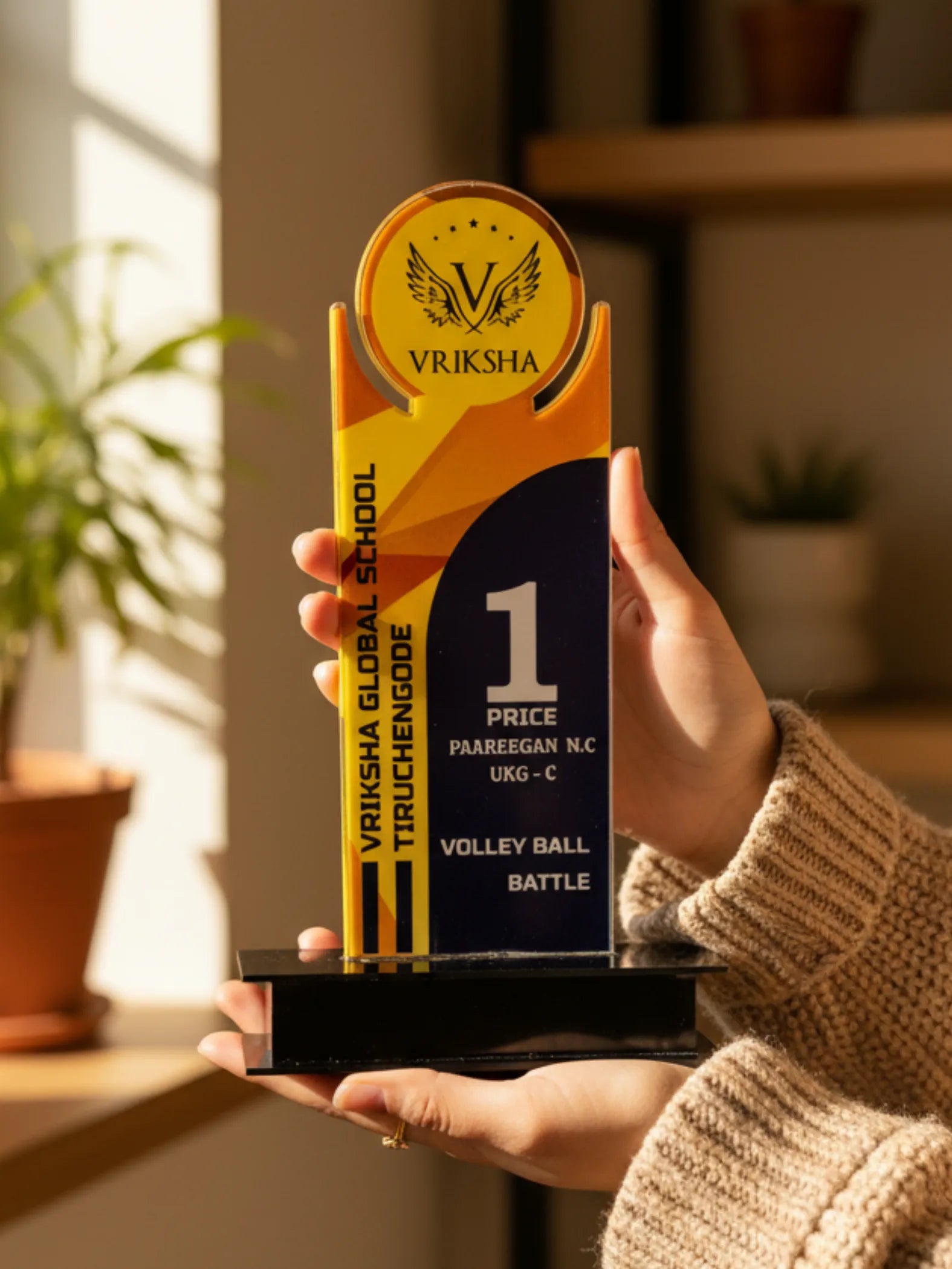 Volleyball trophy size comparison showing different tournament award options