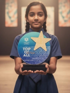 Young girl holding a 'Top of the All' award with a star on it.